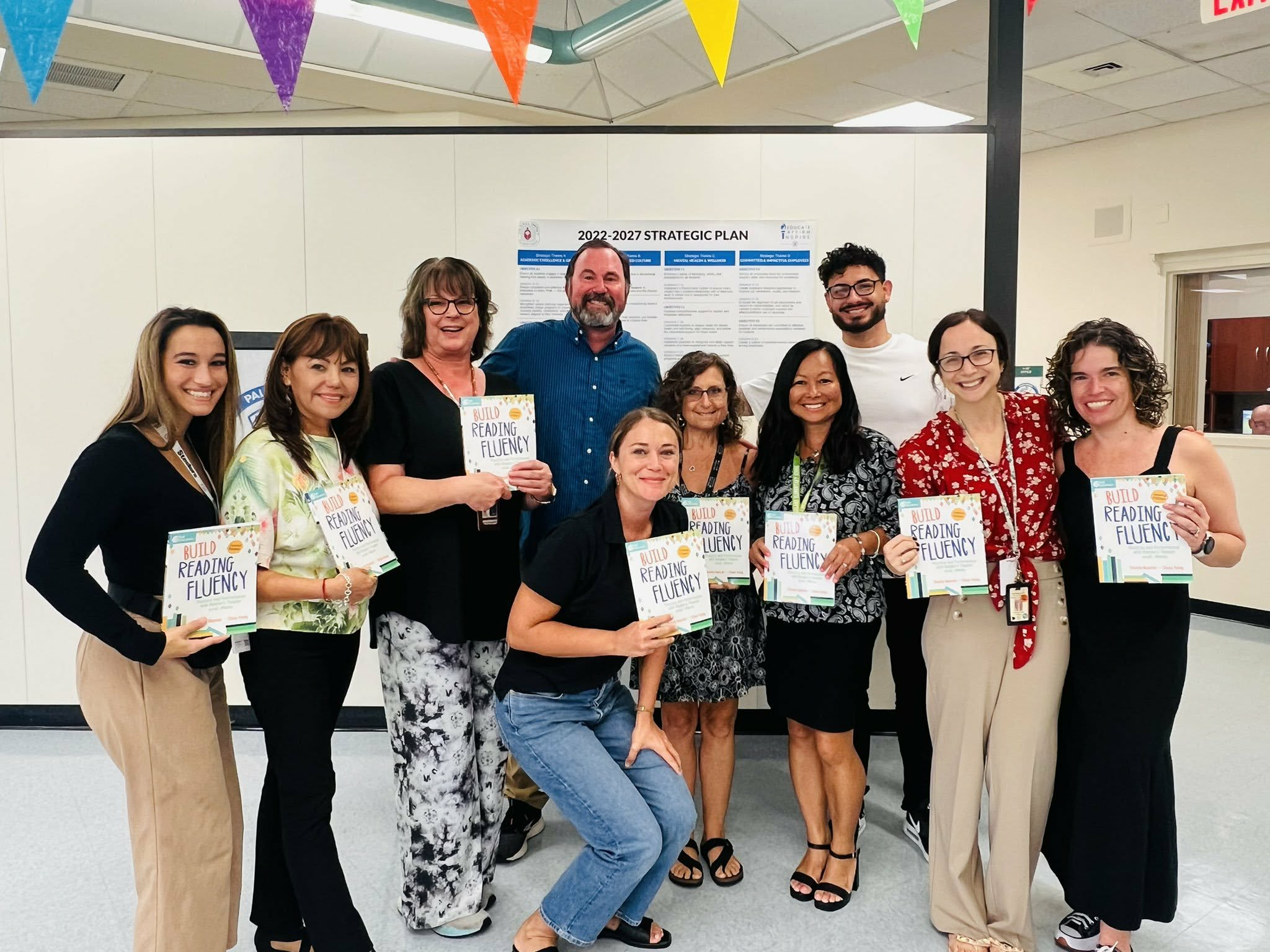 Teachers with Reading Fluency books