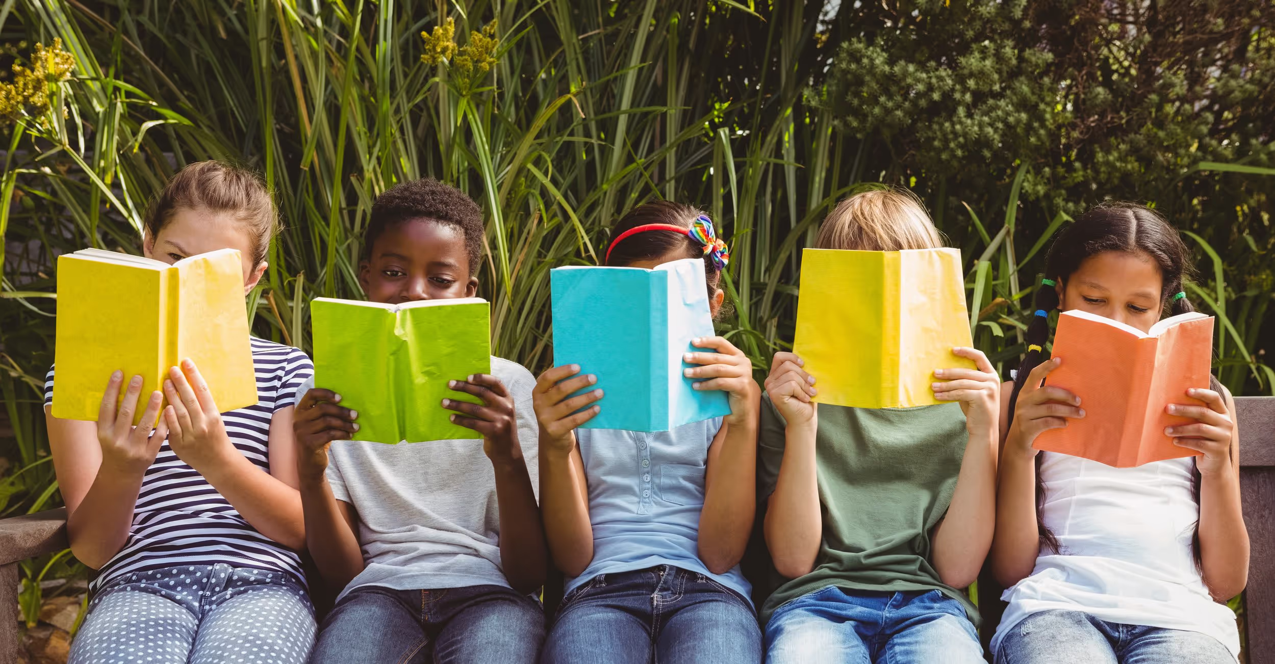 Children reading together in a classroom