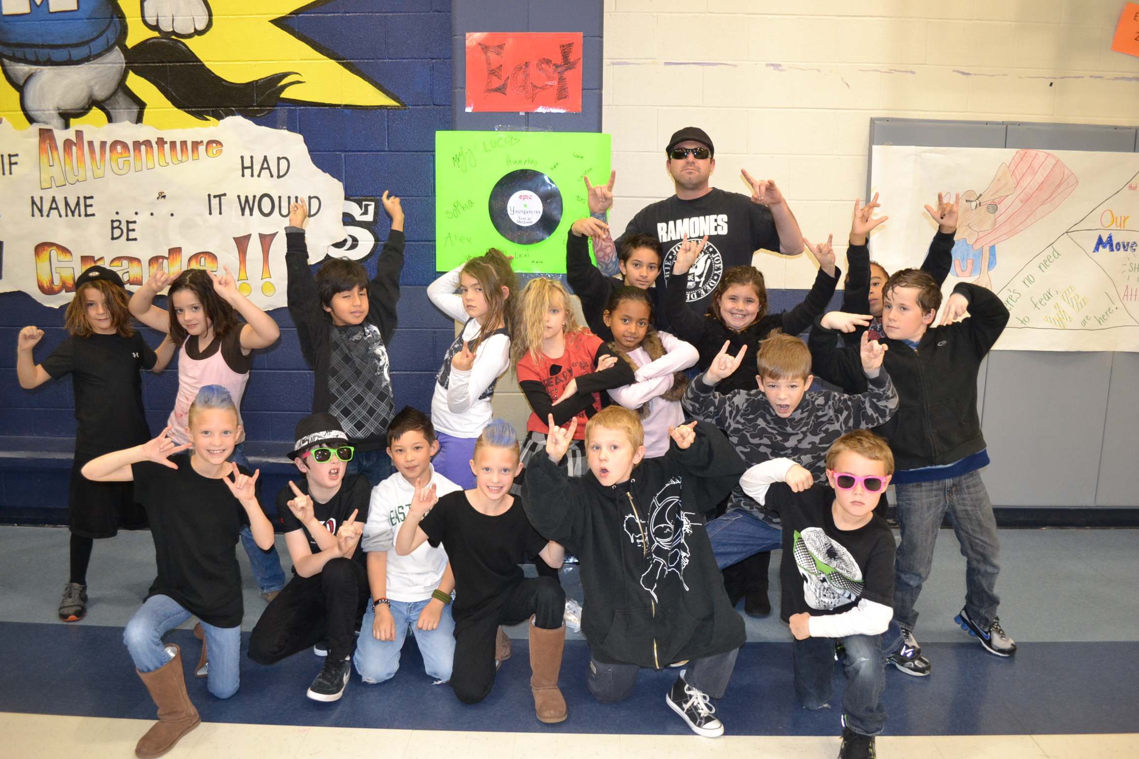 Dr. Chase Young's class, 'The Youngenites,' dressed as a team and posing together in the school hallway